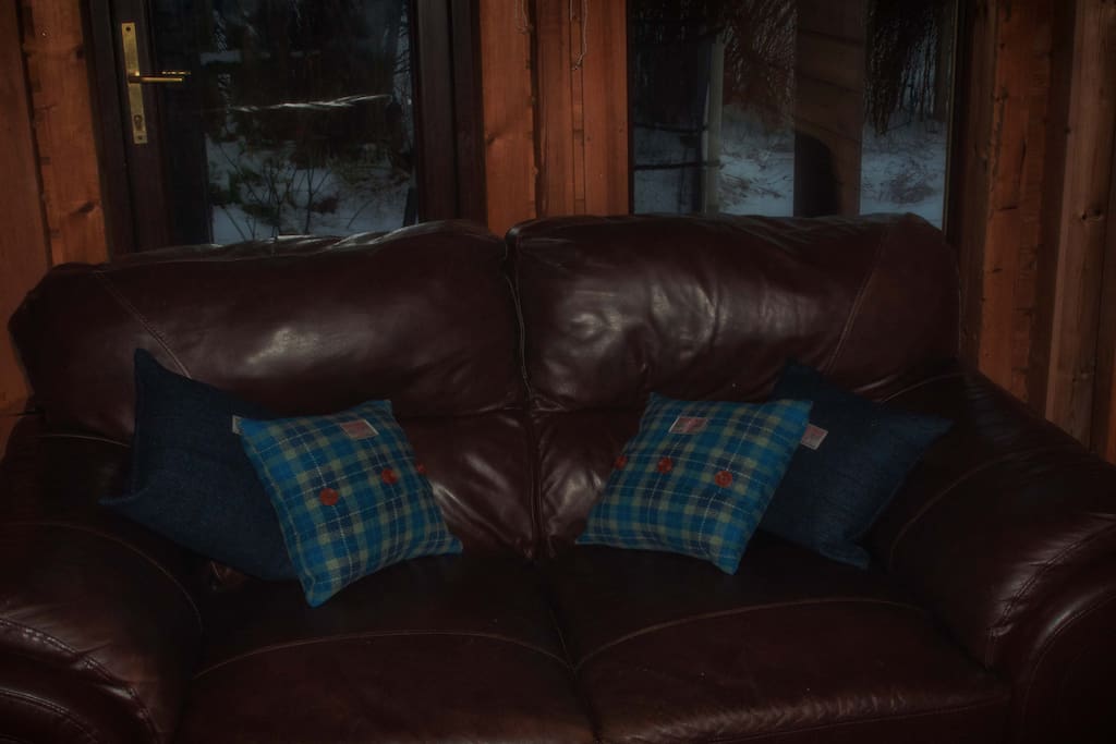 leather sofa with Harris Tweed cushions