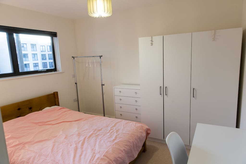 the room with double bed & desk
