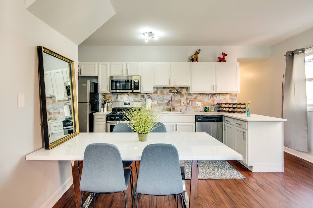 Our dining table has plenty of space for 6 chairs - you'll find the other two in bedrooms if your whole group wants to dine together