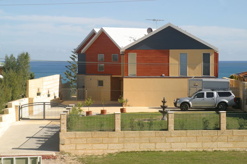 The main residence with secure parking behind electric gates.