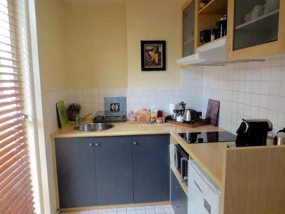 Kitchenette showing door to balcony