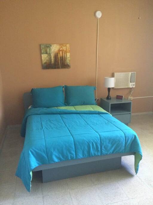 Bedroom: full size bed, night table, A/C and closet