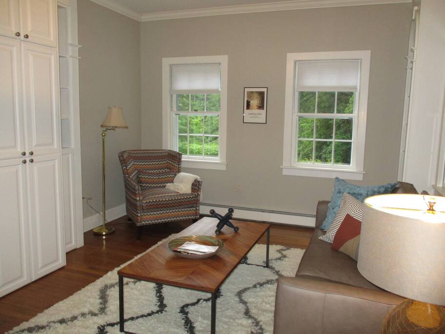 Living Room with 12ft ceilings and built in cabinets.