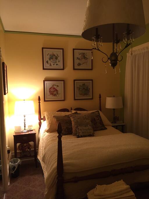 Cross-stitched Norman Rockwell scenes of the four seasons complement the bedroom.