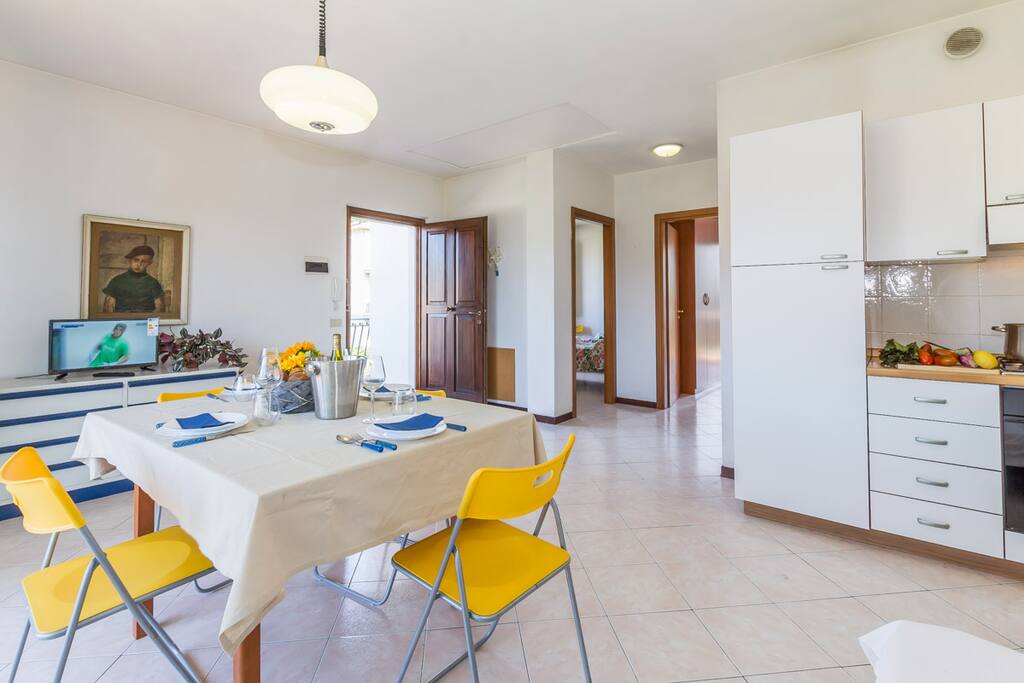 Open plan living room with entrance to the terrace