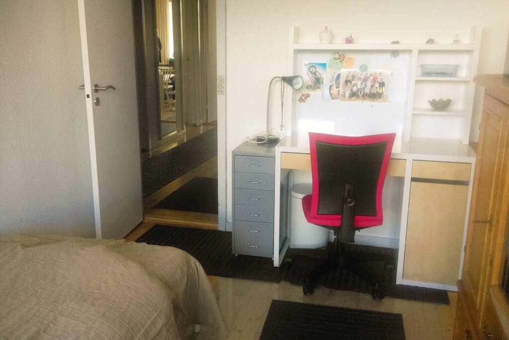 A desk which you may use during your stay. It drawers will be emptied, so you can have some things in there during your stay.