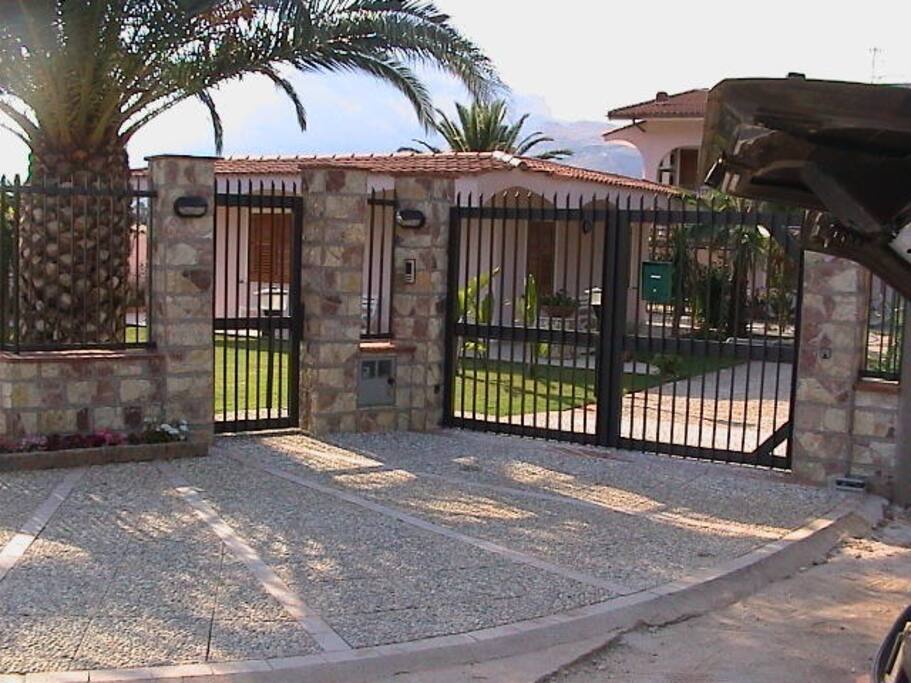 The electric iron gates entrance to villa Rosada