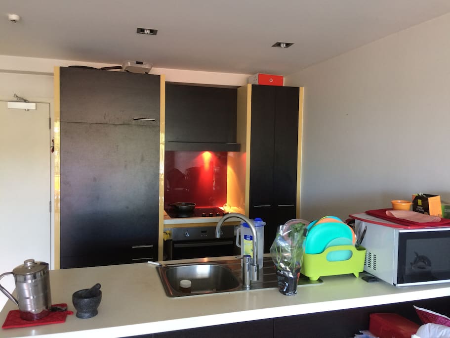 Clean kitchen with access to a compartment in the fridge and freezer