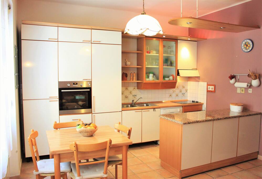 Dining table and kitchen.