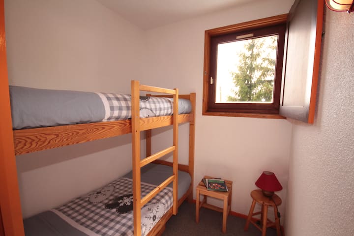 Room overlooking mountain pastures in summer and ski slopes in winter.