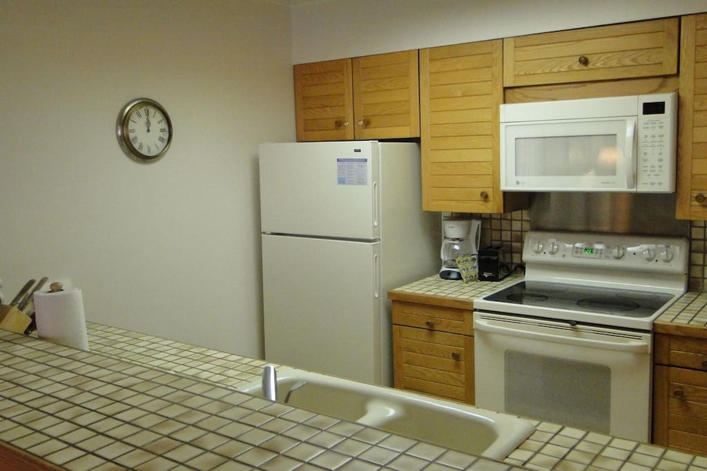 Kitchen - This kitchen has everything you need to prepare full meals during your stay. Fully stocked with pots and pans, and small appliances.