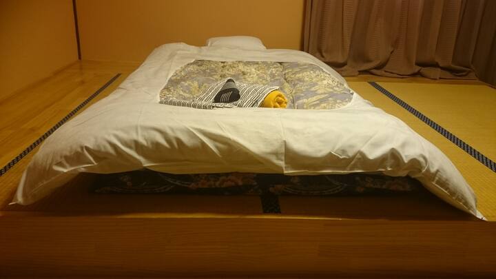 Futon beddings on raised tatami mats. Extra beddings available.