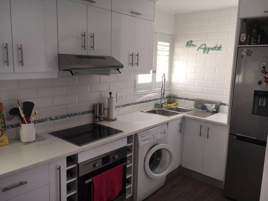 Kitchen with washing machine.