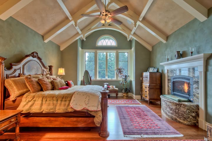 Luxurious master bedroom with mountain view and access to private spa