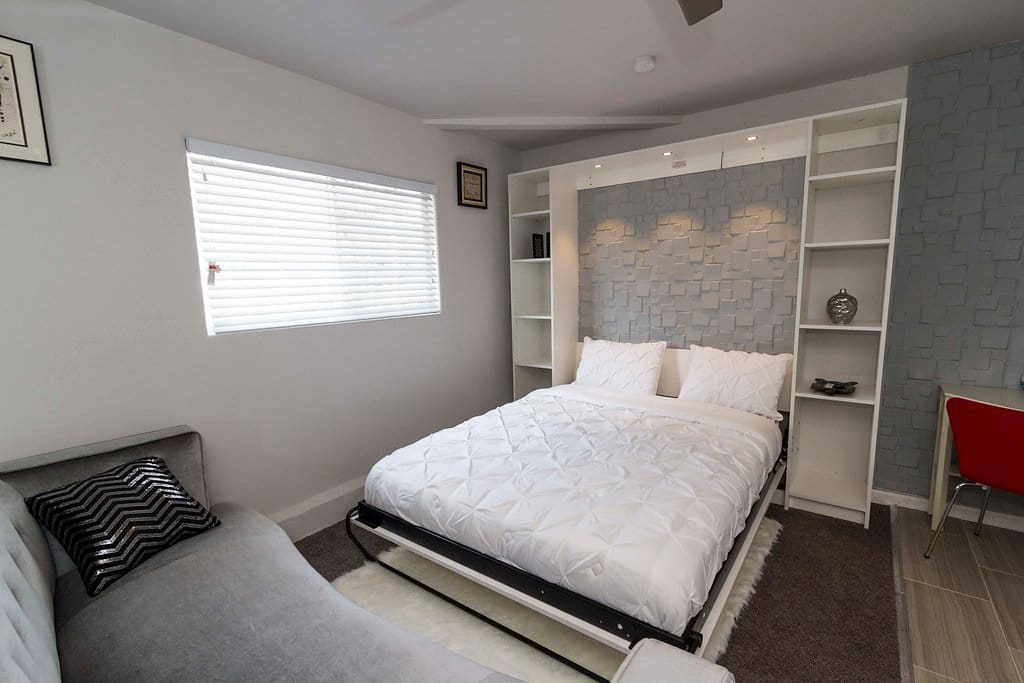 Queen size bed with lights , ceiling fan also has lights