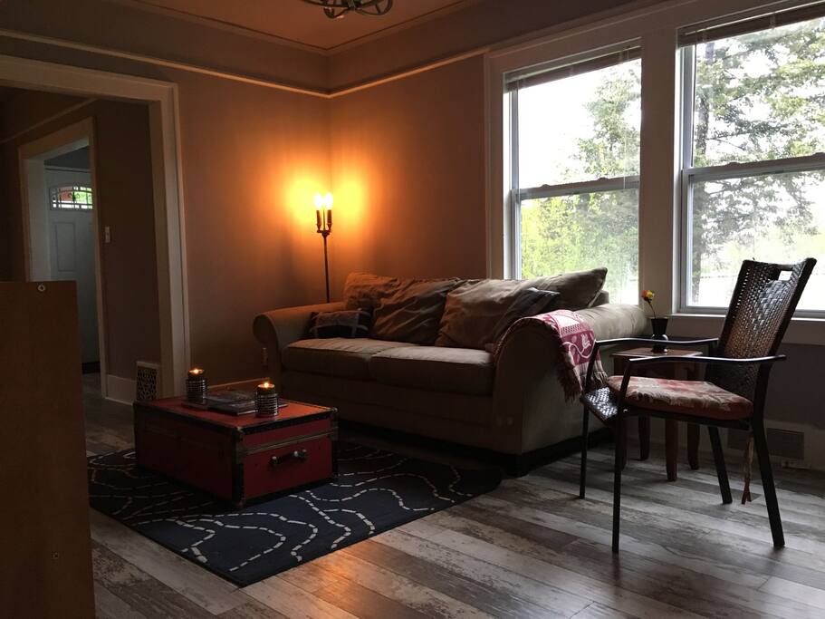 The living room opens up to our extensive side yard and directly overlooks our lovely fire pit constructed using reclaimed bricks.