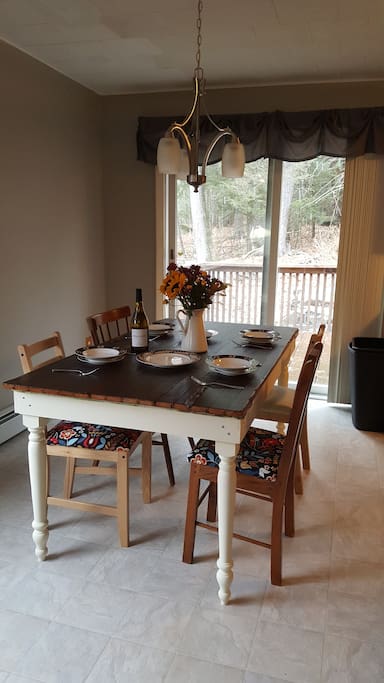 Dining Room features a rustic table owners made from reclaimed barn door.