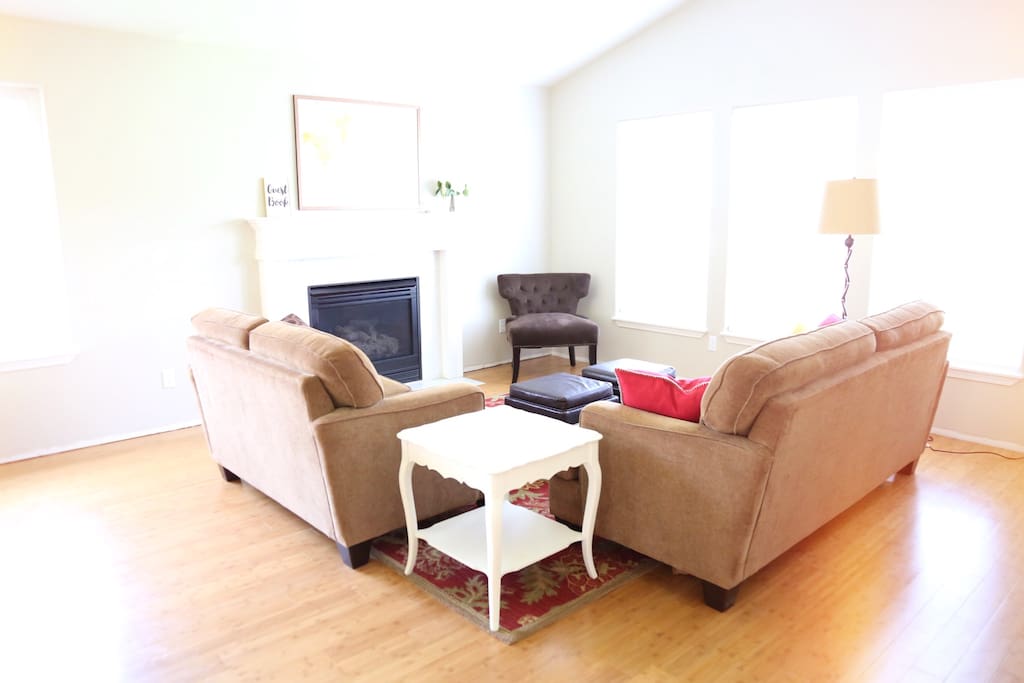 Large formal living room with gas fireplace.