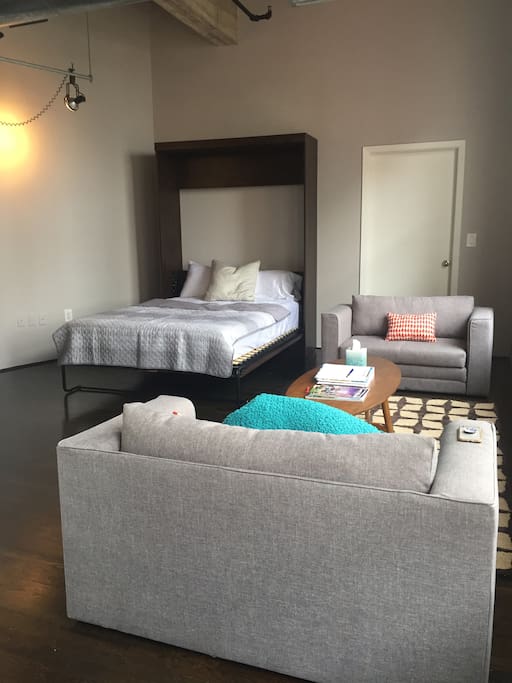 Queen size Murphy bed; futon chair and a half folds out to twin size bed