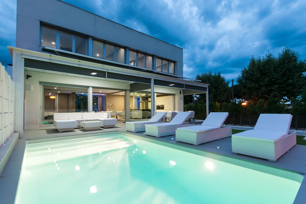 pool and house view by night