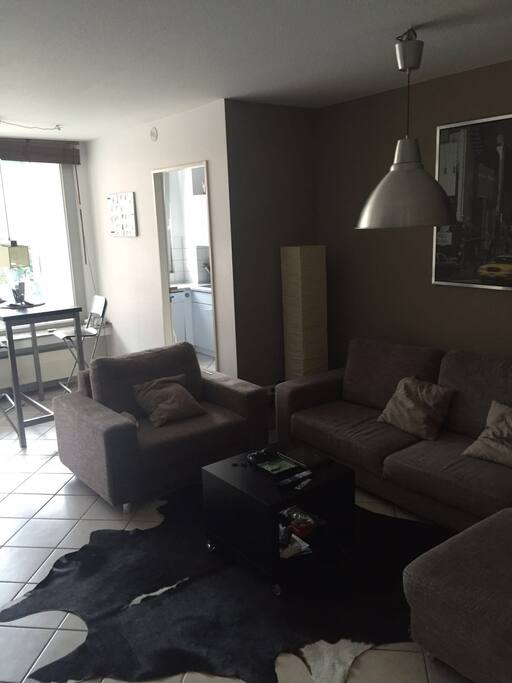 The large main room of this very centrally-located flat consists of the living and attached eating area. It leads to the master bedroom as well as the spacy balcony.