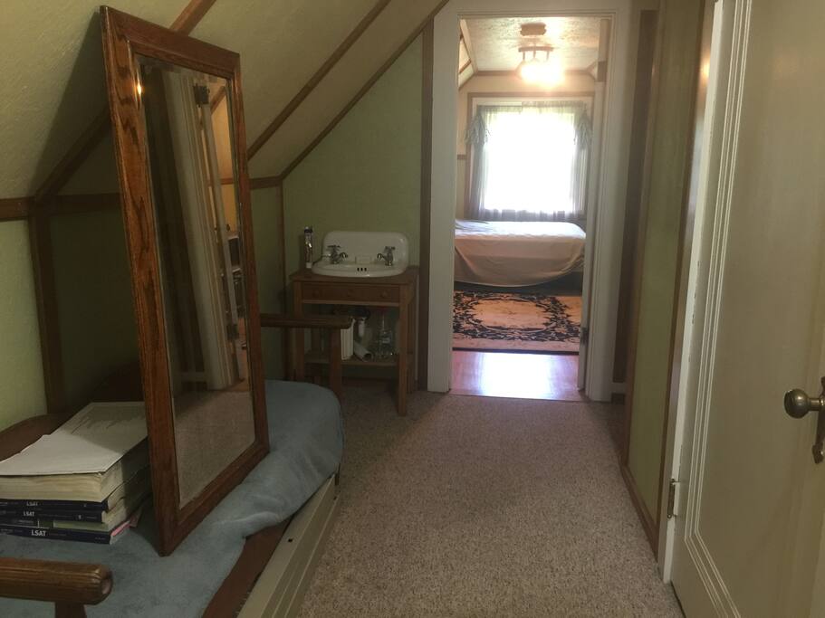 View upon entering the bedroom. Full length mirror across from the cedar closet. Plenty of room on the table to lay out your belongings as well