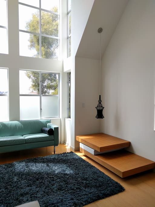 Designer lamp creates a warm glow when the light bounces off of the table at night.