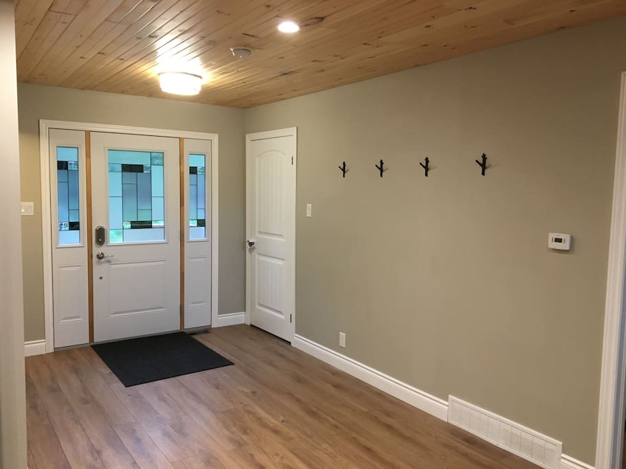 Front hallway with hooks for coats, hats, etc...