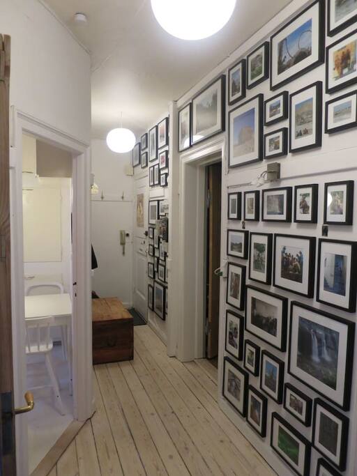 Entrance with pictures of travels from all over the world