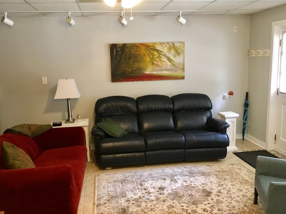 Very comfortable living room and the leather sofa is a double recliner