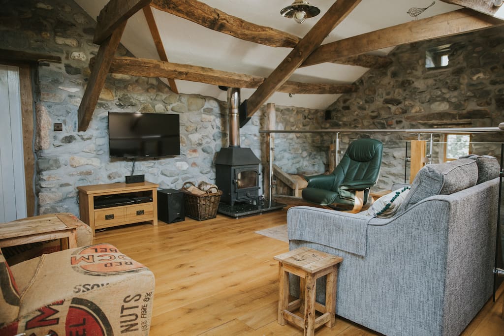The lounge is upstairs with an oak floor, underfloor heating and a woodburner for added romance.