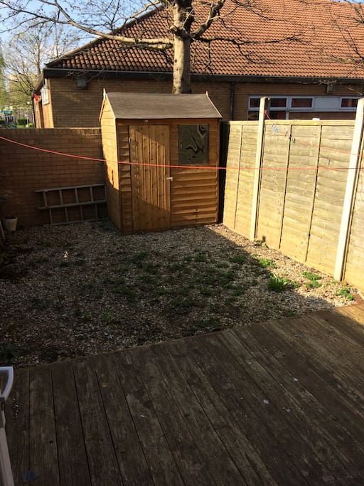Garden which receives sunlight during the day. 2 patio chairs and table to use outdoors