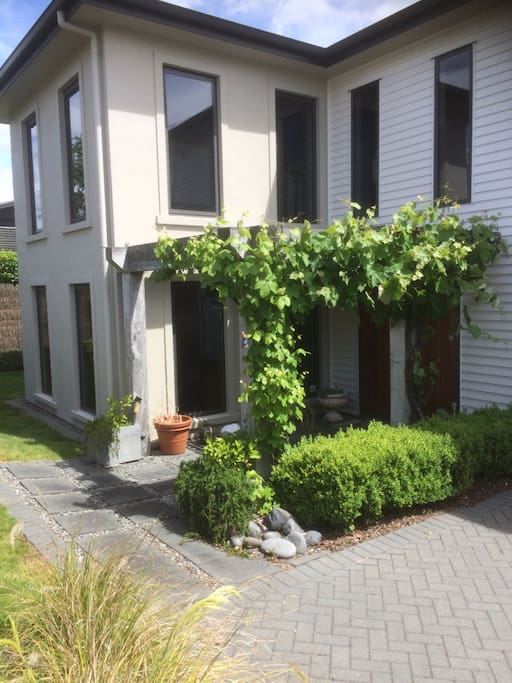 Kaka Street home ripe grape vines overhanging entrance