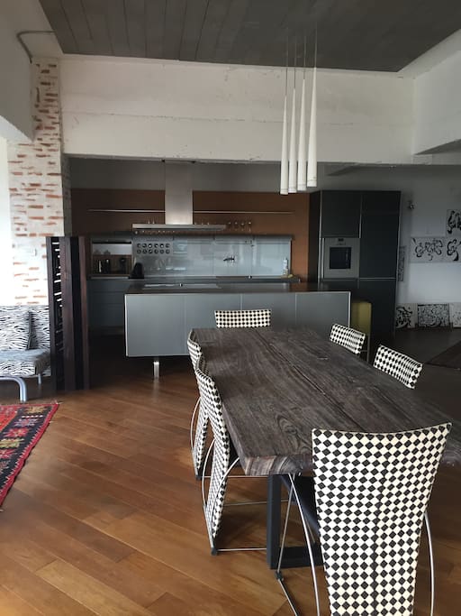 view from balcony into living/dining area