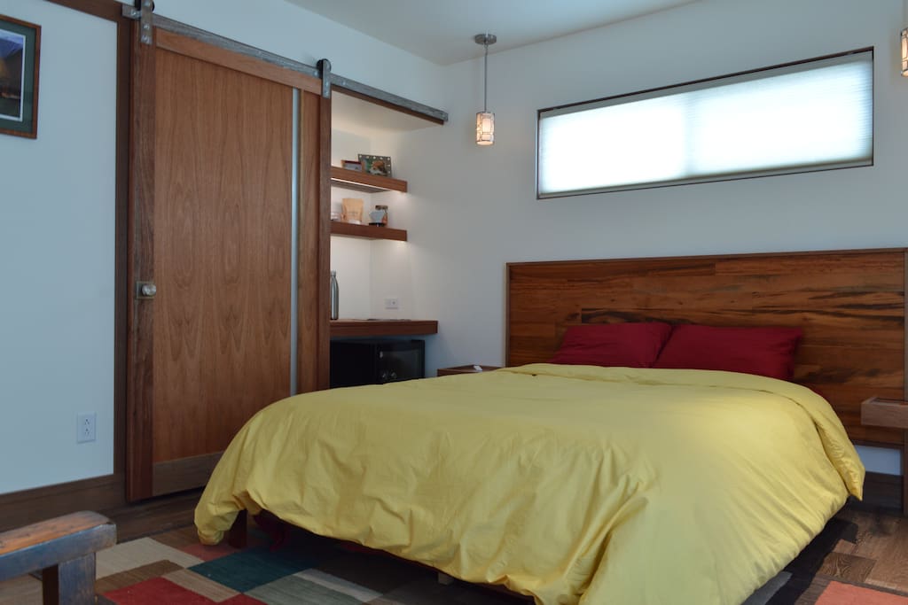 Queen bed featuring cool comfortable down duvet + with tigerwood accents