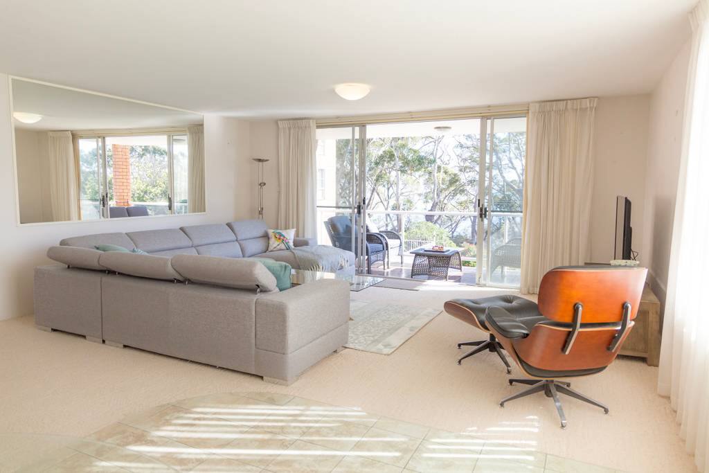 Spacious open plan living area leading to one of two balconies
