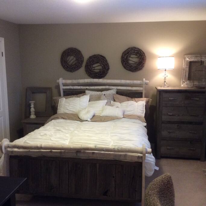 New queen sized bed with lots of storage and desk.