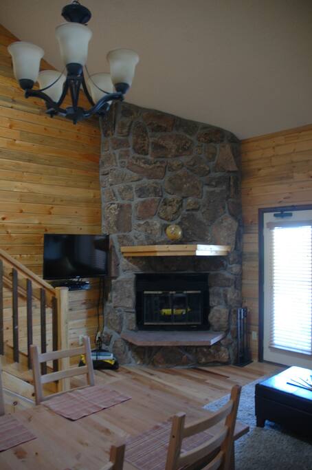 Flat screen TV and fireplace.