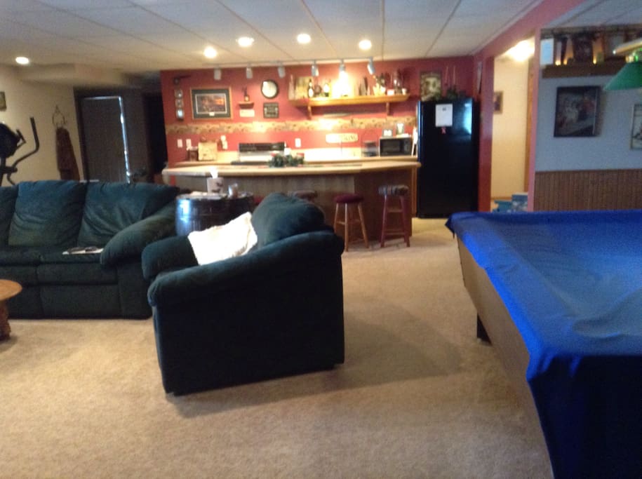 Kitchen, living area and pool table.