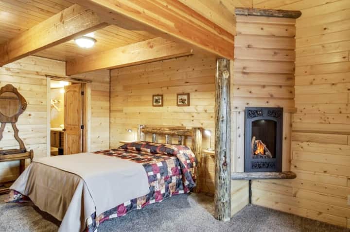 The master bedroom downstairs has a queen bed, private ensuite bathroom and a fireplace to keep you warm and cozy! 