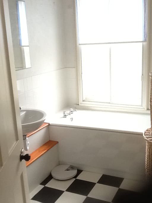 The bathroom is next door to your room
