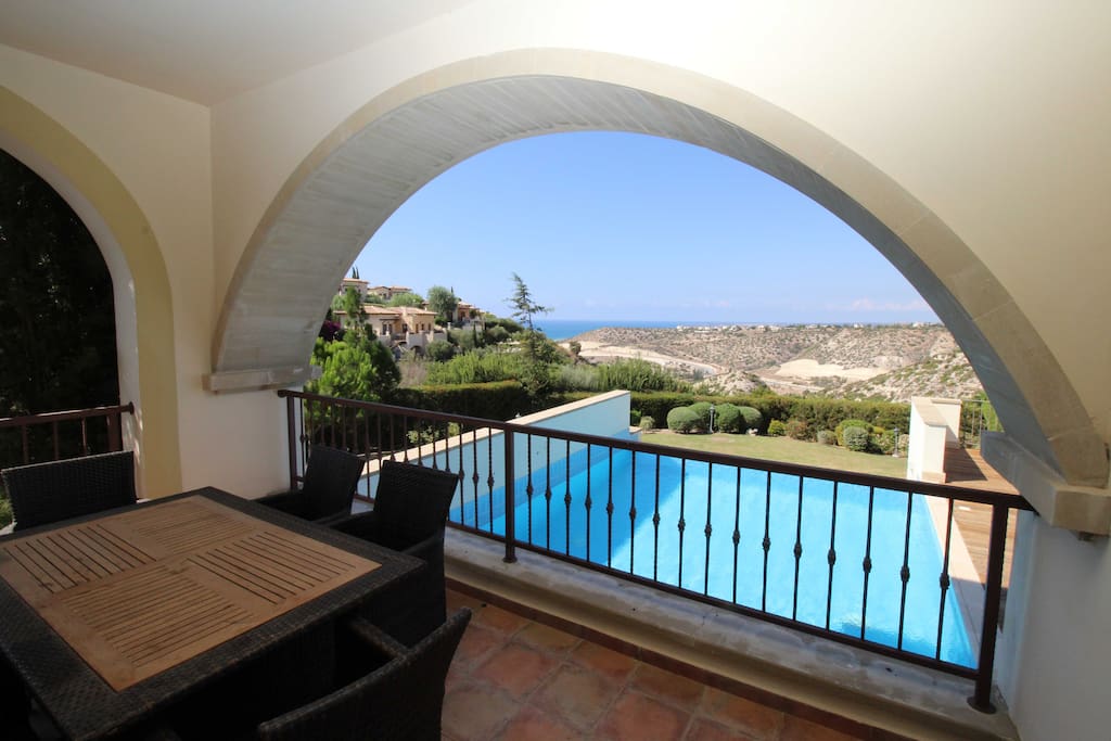 Terrace overlooking pool, sea and mountains