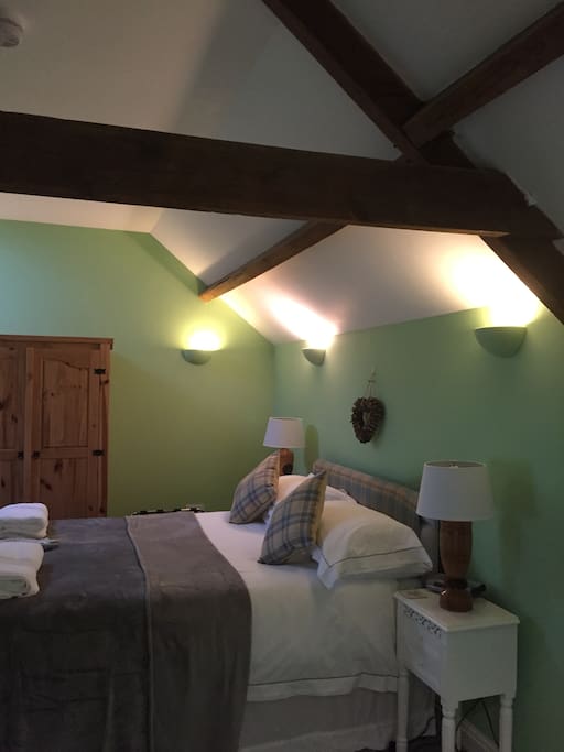 Luxury bedroom with White Company Linen and cotton robes plus Moulton and Brown toiletries.