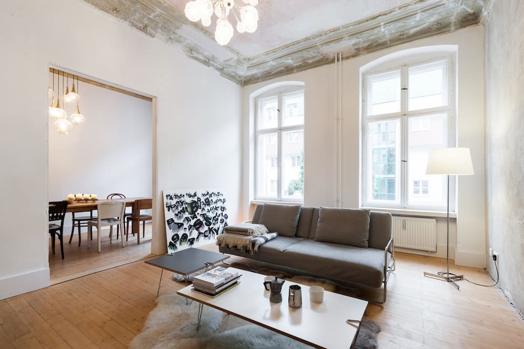 Lounge with original art nouveau plasterwork, 1950s Sputnik chandelier and view to the dining room / workspace.