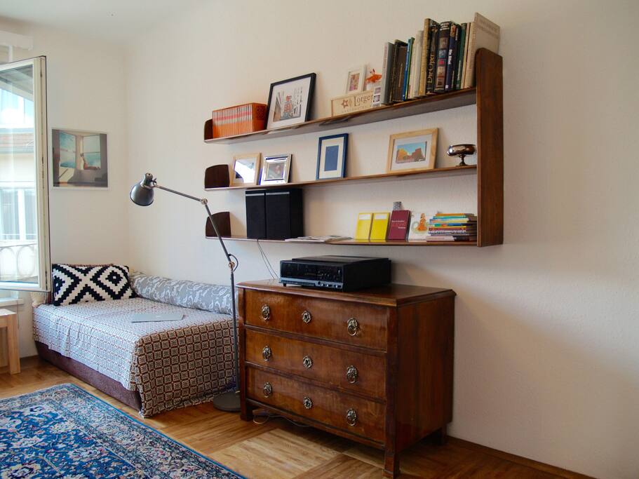 living room (couch can be used as single bed for guests)