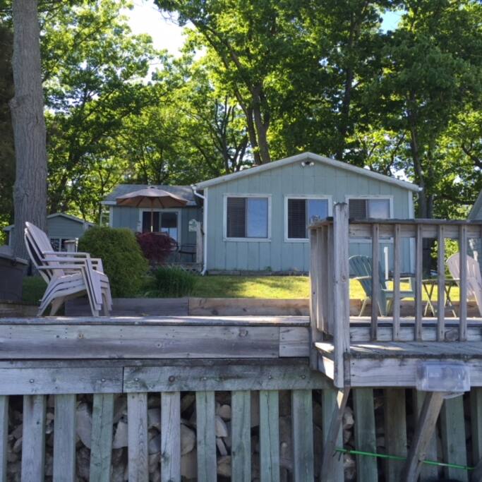 View of front of cottage from beach
