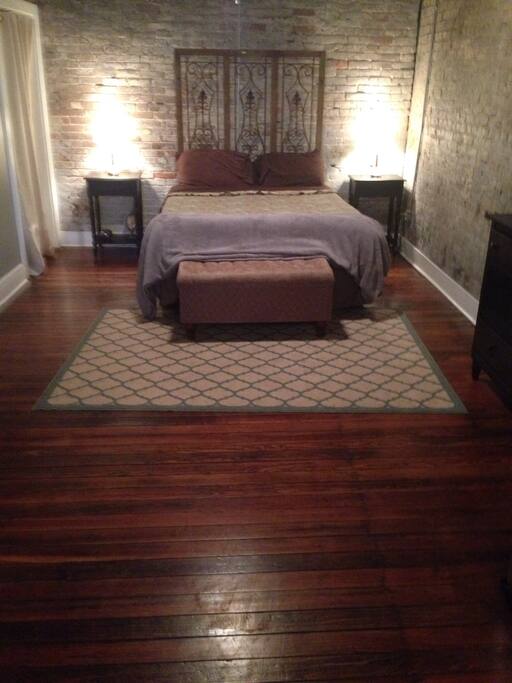 One queen size bed in studio apartment.
