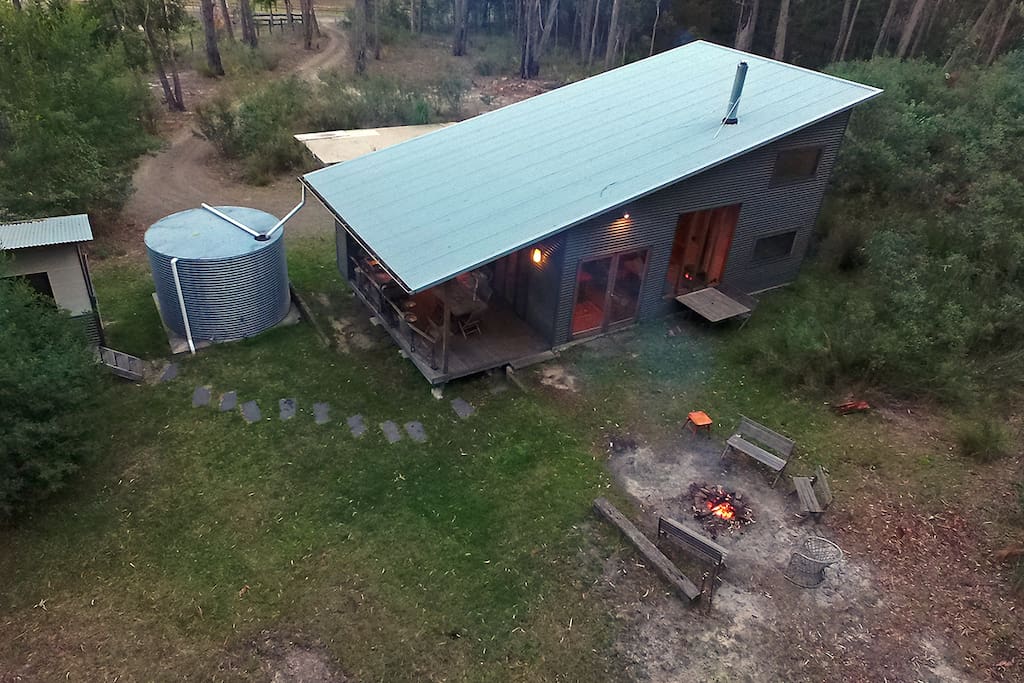 On five acres, surrounded by forest.