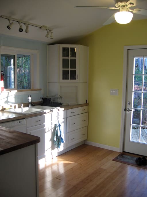 Kitchen with butcher block countertop.