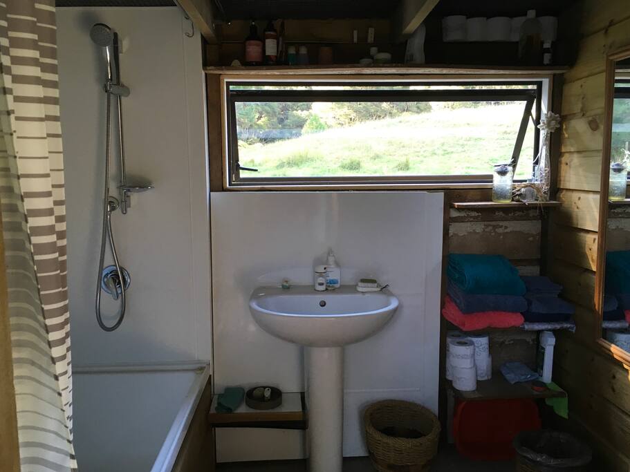 Attached eco bathroom, shower over bath